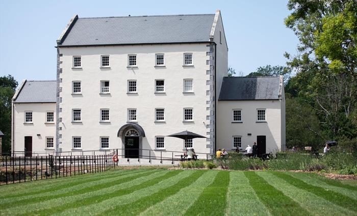 An image of Black Pool Mill during the summer.
